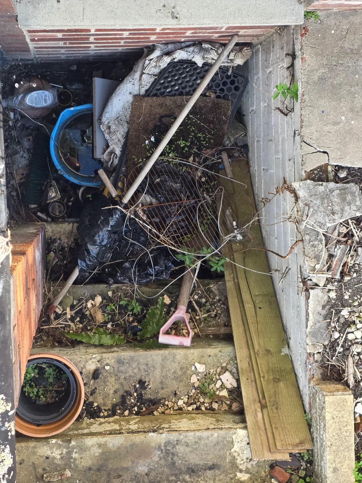 Before: basement steps full of rubbish before a Kruze clearance, Leeds LS4