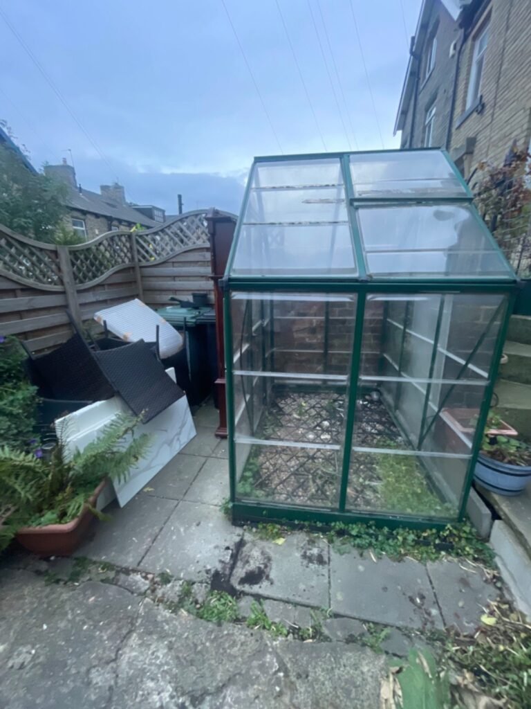 Before: greenhouse and garden furniture removal by Kruze, Bradford BD12