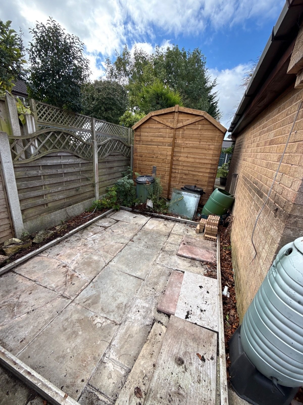 Greenhouse removed and patio cleared by Kruze, Leeds LS17
