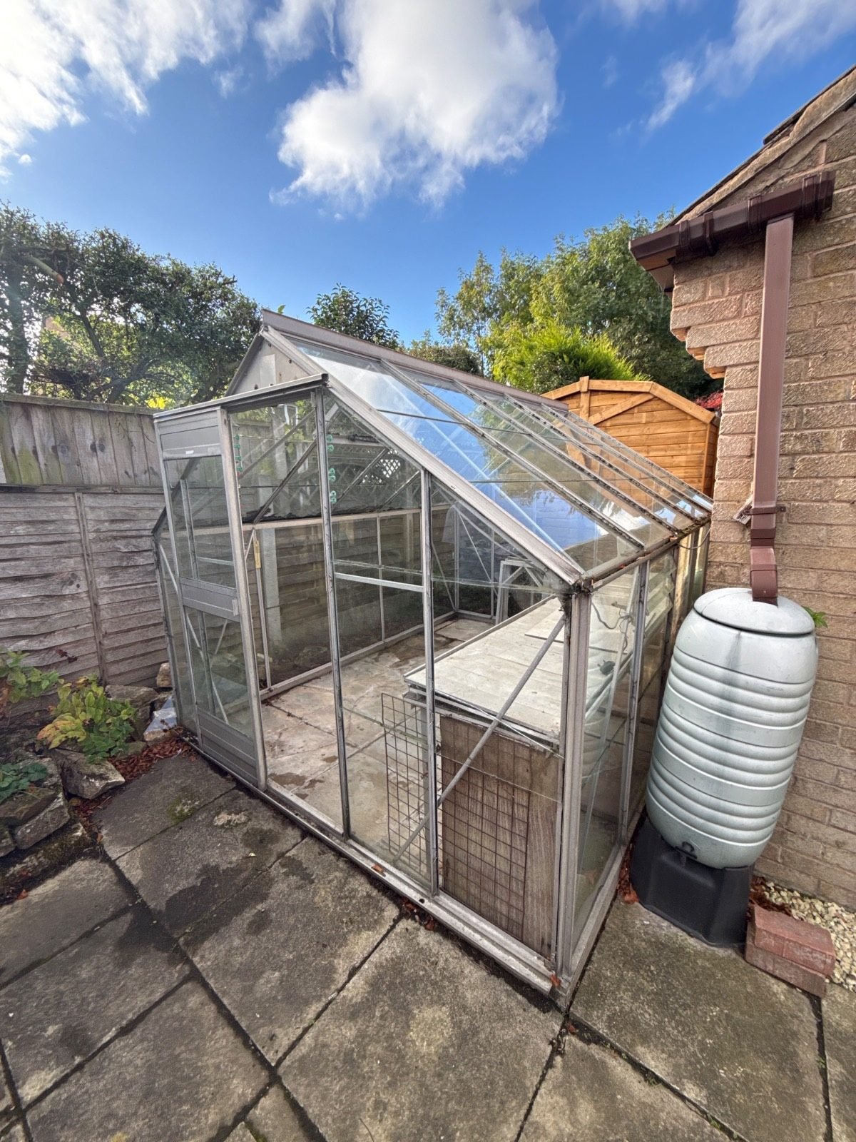 Greenhouse waiting for removal by Kruze, Leeds LS17